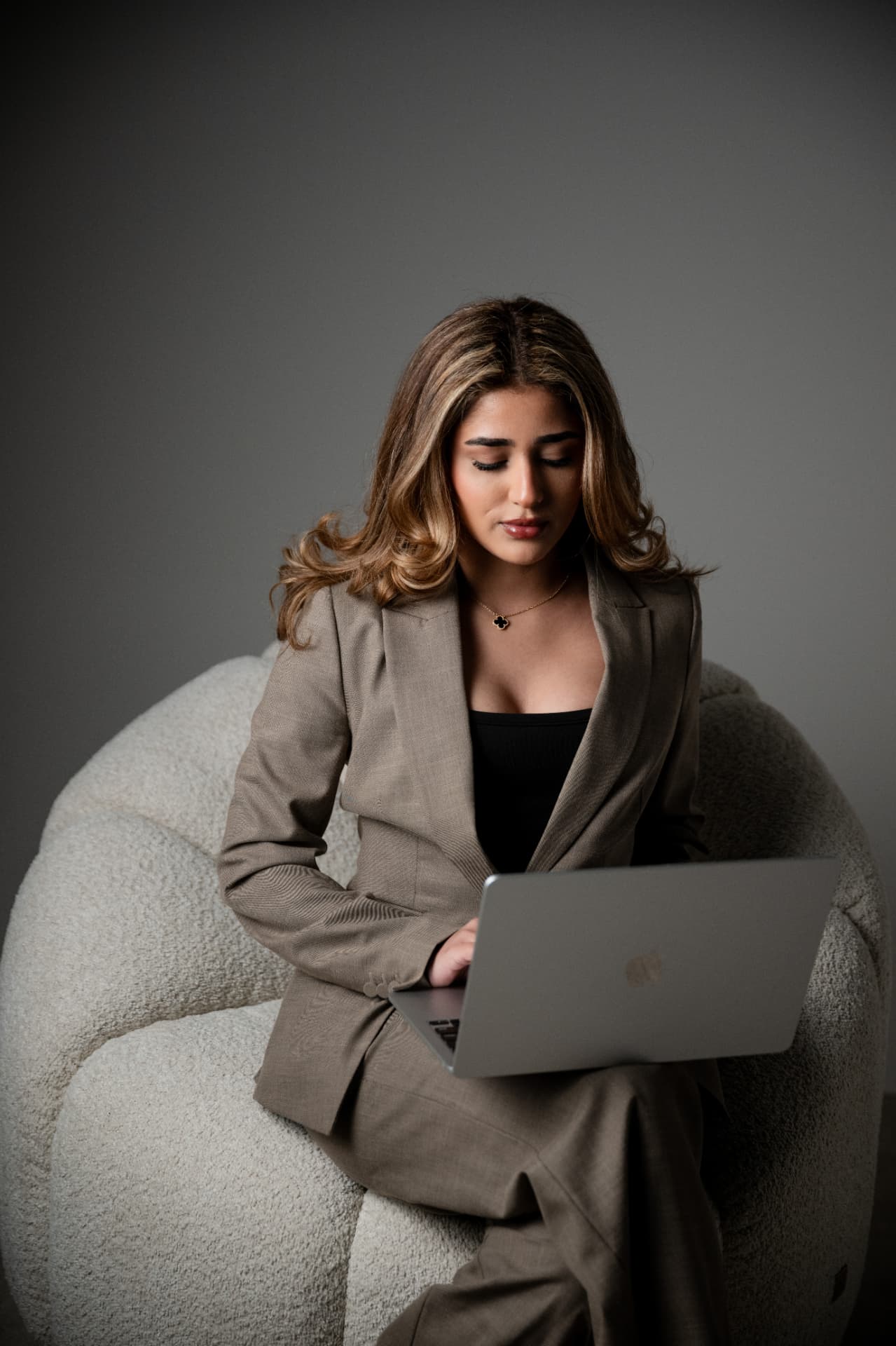 Rania Savari working at her laptop